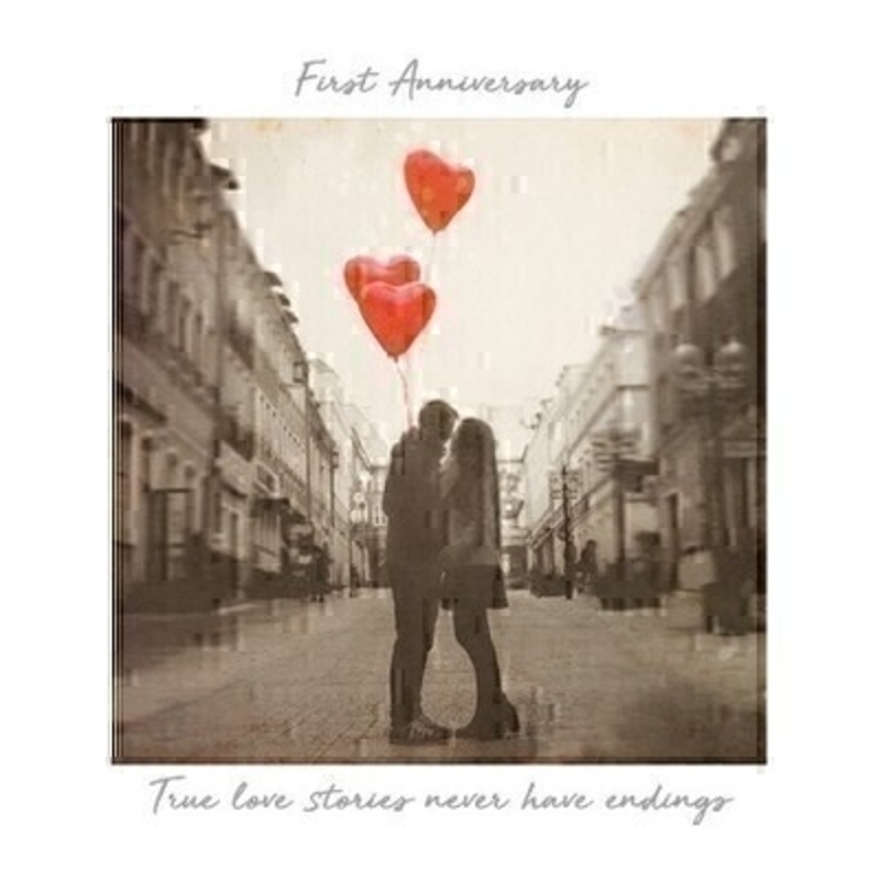 First Anniversary Greetings Card by Paper Rose This Anniversary greetings card for a First Anniversary features a black and white scene of a couple kissing in the middle of the road holding bright red love heart balloons  with the inspirational message True Love Stories Never Have Endings written on the front.  This card is perfect to send to someone celebrating a First Anniversary and has been left blank inside so you can write your own message. It comes complete with a red envelope and is a lovely card from the Art Group.